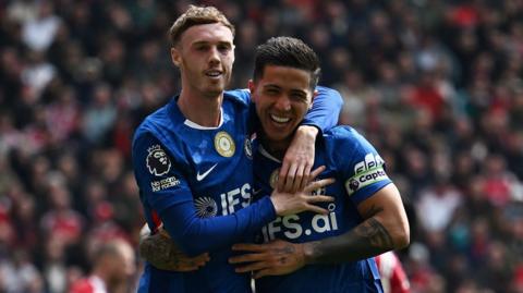 Cole Palmer celebrates Enzo Fernandez's equaliser by putting his arm around his teammate