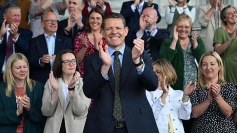 eader of Plaid Cymru Rhun ap Iorwerth poses with newly elected Plaid Cymru MSs for a group photograph on the steps of the Senedd, home of the Welsh Parliament