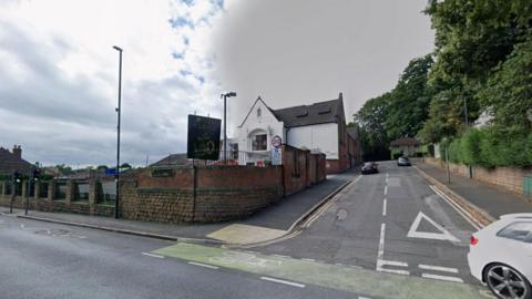 Streetview image of Linnell Street, a short urban road with a large Victorian buildings on one side and residential houses on the other