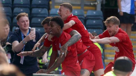 Birmingham players celebrate their late winner at Blackburn