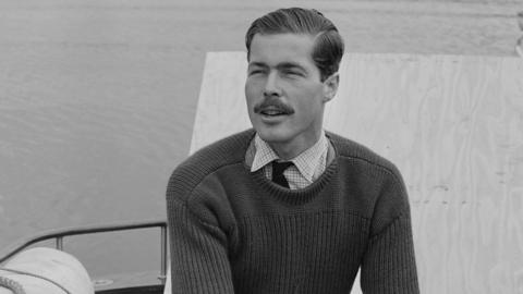 John Bingham, 7th Earl of Lucan (Lord Lucan) (1934-1974) pictured working on the engine of his powerboat 'White Migrant' as he prepares to compete in the Daily Express Cowes-to-Torquay powerboat race in England on 4th September 1963. 