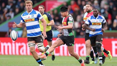 Marcus Smith kicks the ball forwards for Harlequins