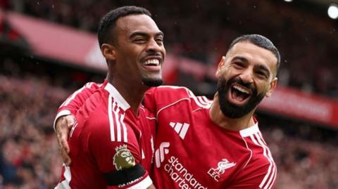 Ryan Gravenberch and Mohamed Salah celebrate during Liverpool's win over Everton