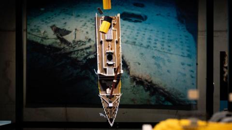 A Lego model of RMS Titanic in case under the sea