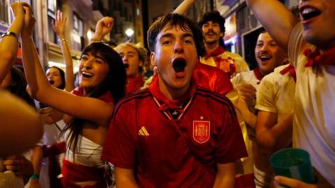 Spanish fans celebrate winning against France