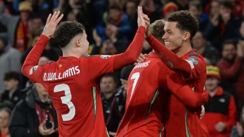 Wales celebrate a goal against Finland