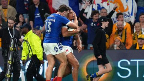 Aaron Grandidier-Nkanang of France celebrates scoring his team's third try with Fabien Brau-Boirie