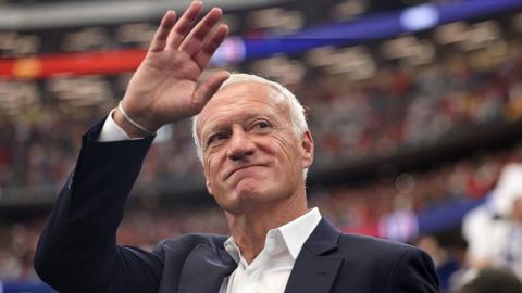 Didier Deschamps waves to the crowd following France's defeat to Spain