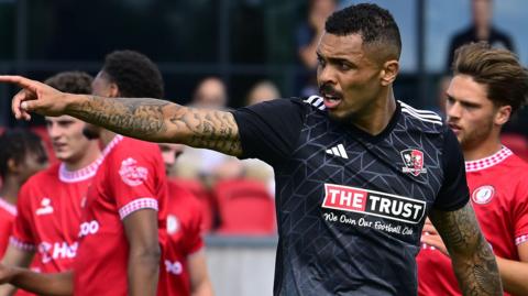 Josh Magennis celebrates after scoring for Exeter City