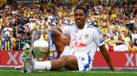 Junior Firpo with the EFL Championship trophy