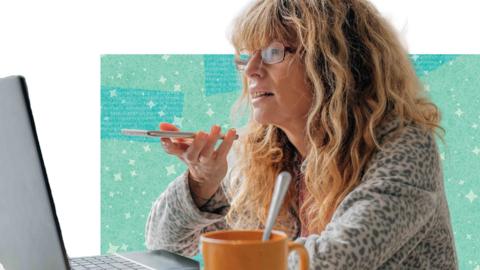 Woman looking at her laptop and talking on her phone
