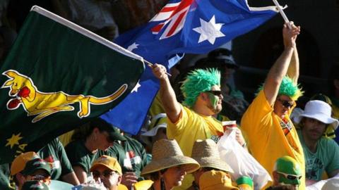 Australia fans wave flags at the Gabba in 2006