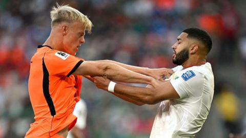 Jan Paul van Hecke and Ismail Saibari tussle