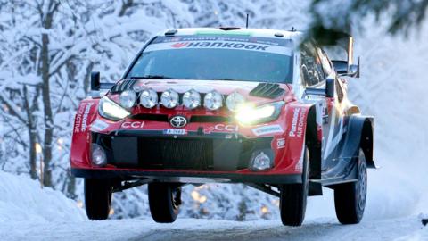 British driver Elfyn Evans and co-driver Scott Martin find air on a snowy road in their Toyota GR Yaris compete during Rally Sweden