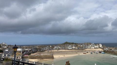 Shower clouds over a coastal village 
