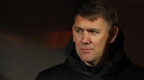 Stockport County boss Dave Challinor looks on