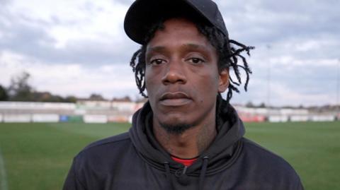 Nile Ranger pictured in a tracksuit, looking at the camera