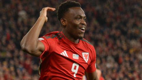 Wales forward Rabbi Matondo celebrates