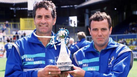 Frank McLintock (left) and John Docherty hold aloft the Division Two title