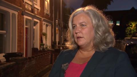 UK Transport Secretary Heidi Alexander wearing a black blazer and red blouse