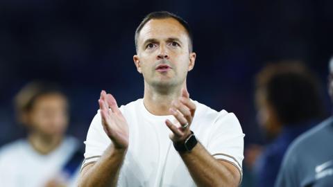 Birmingham boss Chris Davies applauds the fans at Leicester