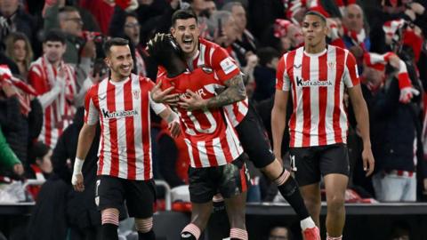 Athletic Bilbao's Spanish defender Yuri Berchiche celebrates scoring his team's second goal with teammates during the UEFA Europa League last 16 second leg football match between Athletic Club Bilbao and AS Roma at the San Mames stadium in Bilbao.