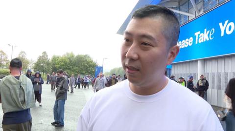 A picture of South Korean fan James outside the Amex Stadium after he found out he was not allowed in.