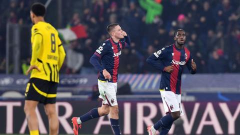 Bologna players celebrate scoring against Dortmund