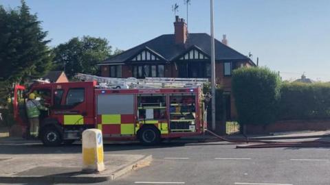 Fire engine outside house