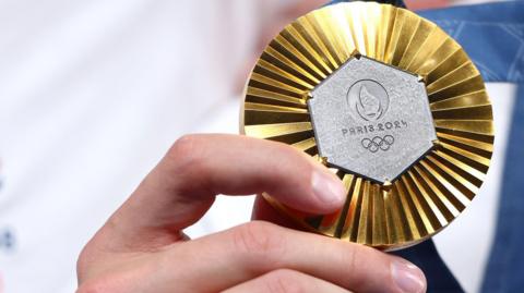 An image of a Paris 2024 Olympic medal