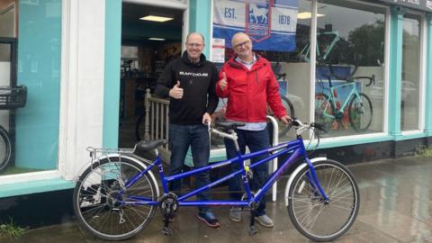 Ian Seeley posing with his tandem bike