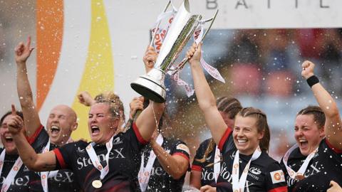 Marlie Packer and Zoe Harrison lift the PWR trophy