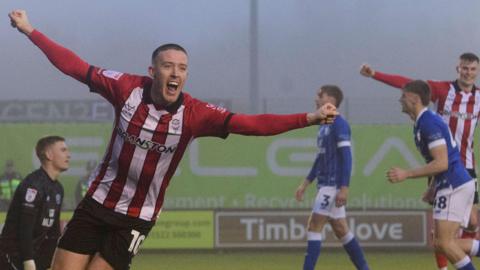 Jack Moylan celebrates scoring for Lincoln City