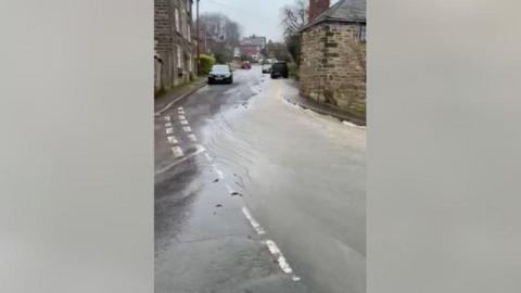 Water coming down Church Street in Fritchley