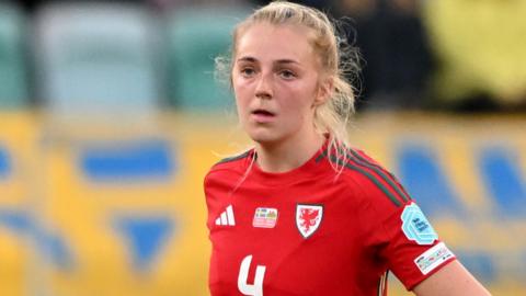 Mayzee Davies playing for Wales