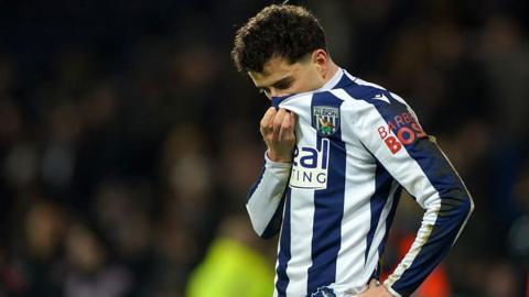 West Brom's Mikey Johnston covers his face with his shirt during their draw against Charlton