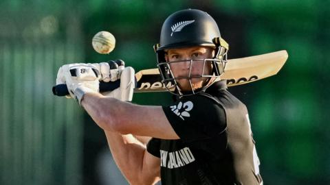 New Zealand's Glenn Phillips plays a shot
