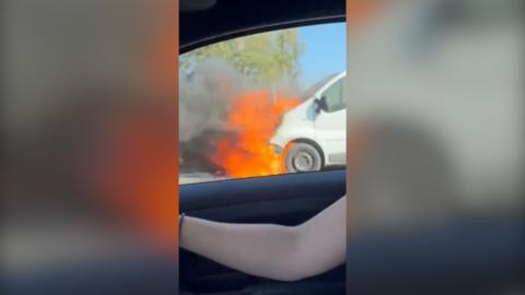 Front of a van on fire