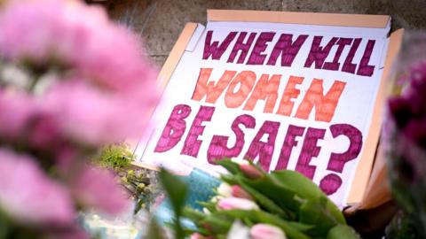 A message is seen among the flowers on Clapham Common where floral tributes have been placed for Sarah Everard on March 13, 2021 in London, England.