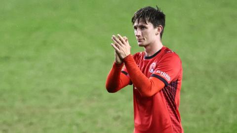 Leyton Orient player claps