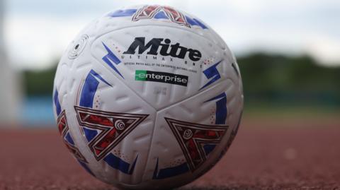 A National League matchball on an athletics track