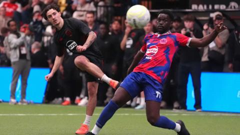 M7 FC's Stefan Ilic shoots at goal past Wembley Rangers FC's Chiekh Thiam during Baller League UK at the Copper Box Arena.