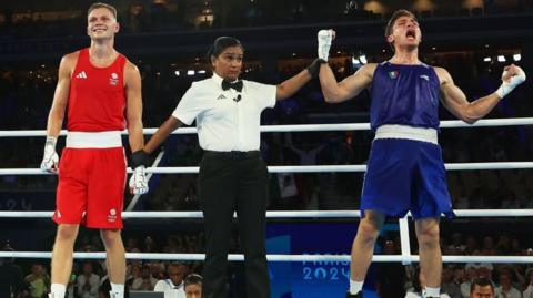 Lewis Richardson smiles as Marco Alonso Verde Alvarez celebrates being announced the winner