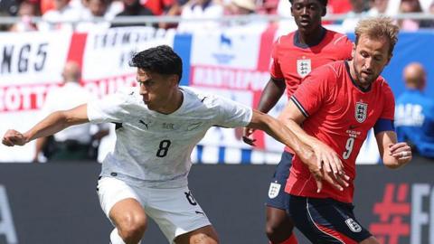 Marko Stamenic holds off Harry Kane 