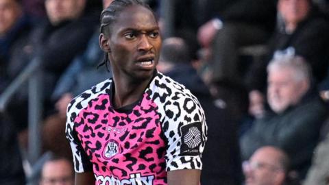 Jili Buyabu in action for Forest Green Rovers in their pink away shirt