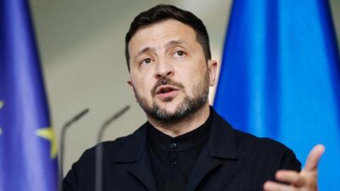 Ukrainian President Volodymyr Zelensky gestures as he speaks during a joint press conference with German Chancellor Friedrich Merz