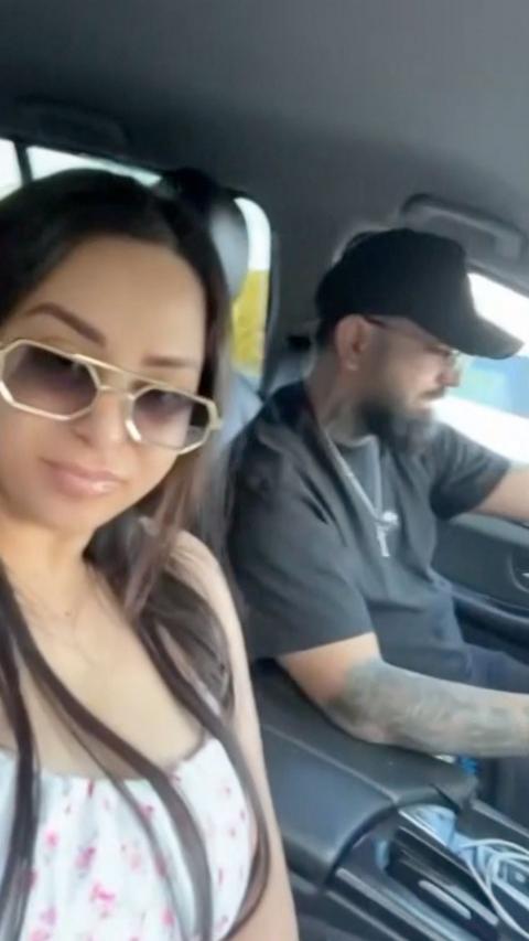 A woman and a man inside a car.