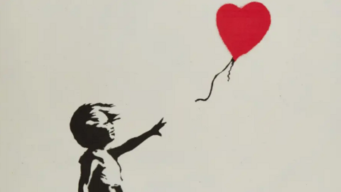 Banksy's Girl With Ballon print. A stencil of a girl letting go of a red heart-shaped baloon.