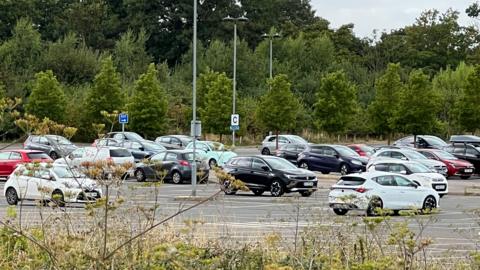 Several cars parked in the car park 