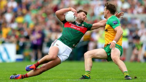 Action between Mayo's Aidan O'Shea and Donegal's Hugh McFadden